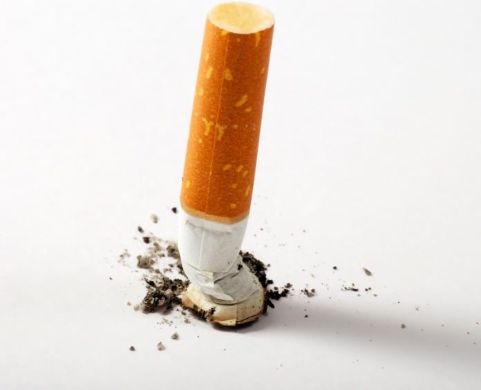 stub of cigarette with ash isolated on white