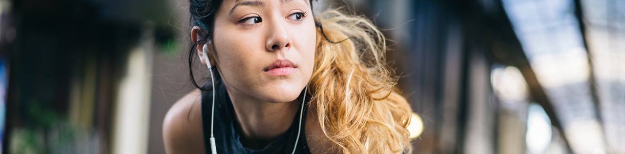Young girl listening to music after exercising