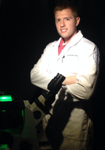 Dr Daniel Roxbury with microscope