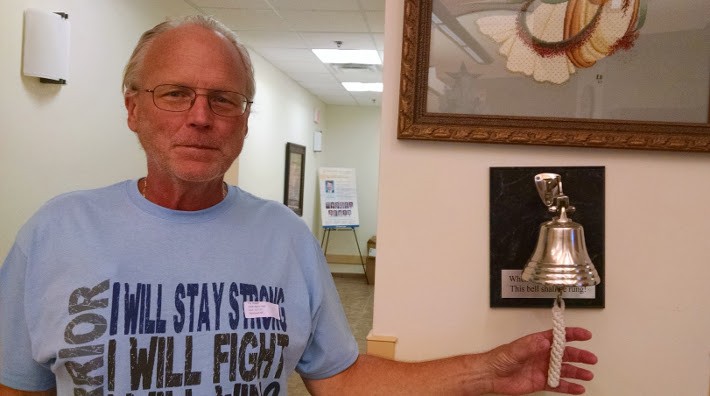 cancer survivor, Robert Fry, ringing the bell at Cape Coral, Florida hospital marking the day of his last chemo treatment
