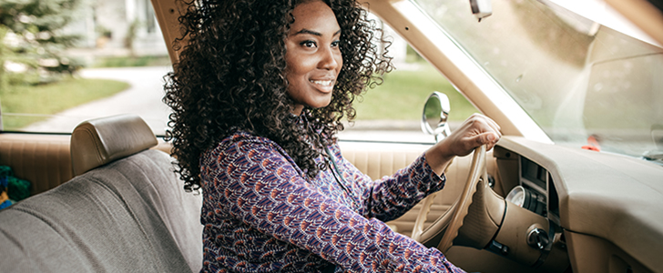 African American woman driving in a car