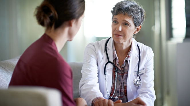 compassionate doctor talking to patient