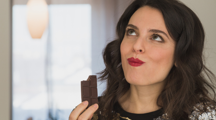 Woman Enjoying Chocolate Bar