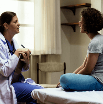 female doctor and female patient talking